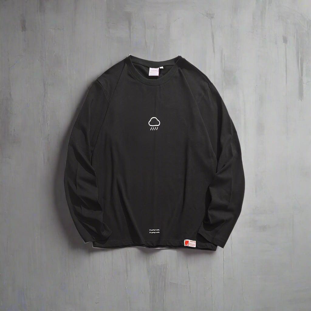 Black long-sleeve shirt with a small logo on a white background